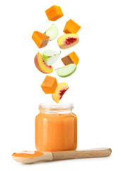 Baby food. Slices of pumpkin, apple and peach falling into jar of puree on white background