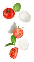 Mozzarella, tomatoes and basil leaves falling against white background