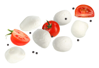Mozzarella cheese and tomatoes flying against white background