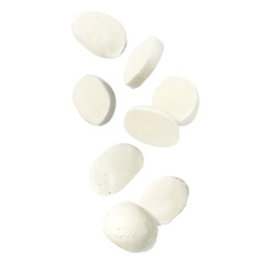 Mozzarella cheese pieces falling against white background