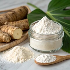 Arrowroot tubers and white powder in glass jar and wooden spoon