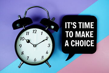 It's Time To Make A Choice text on speech bubble with alarm clock top view on blue, purple and pink...