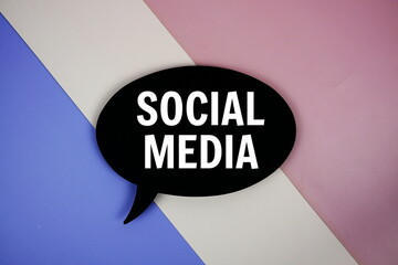 Social Media text on speech bubble top view on purple geometric background