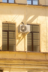 Air conditioners are installed on the facade of the building. device for comfortable living in hot...