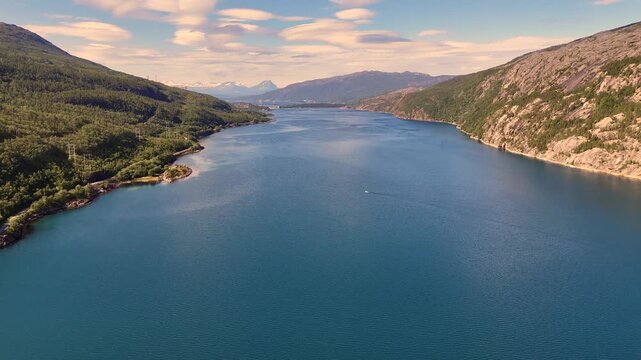 Aerial view of Rombaksbotn bay near Narvik, with deep blue waters framed by forested hills