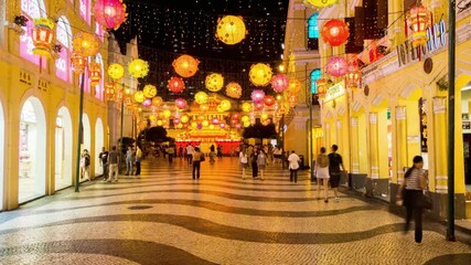 Vibrant street scene in macau, china, with colorful lanterns and bustling crowds