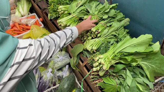 Buying basic vegetable needs at the market. Illustration of basic vegetable needs at a traditional market.