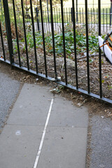 Metal strip marking the Prime Meridian embedded in stone pavement at Greenwich Observatory,...