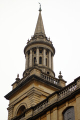 Abstract architectural detail with curved stone structure and soft natural lighting