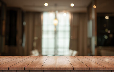 Empty wooden table top with lights bokeh on blur restaurant background.