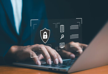 Person typing on laptop with digital padlock shield icon overlay, representing cybersecurity, data protection, privacy, and secure online access in modern technology.