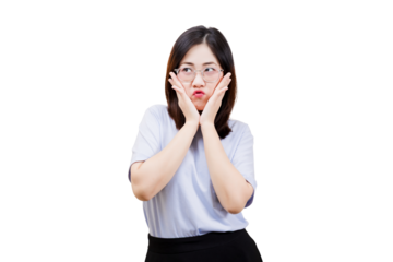 Asian young beautiful woman expresses surprise or confusion with her hands on her cheeks, wearing glasses and a casual outfit.