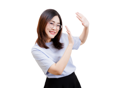 A smiling Asian young beautiful woman in a casual outfit gestures with her hands, expressing enthusiasm and engagement.