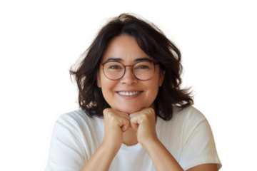 Portrait of a smiling adult woman with dark hair and round glasses, resting her chin on her hands, isolated on transparent background