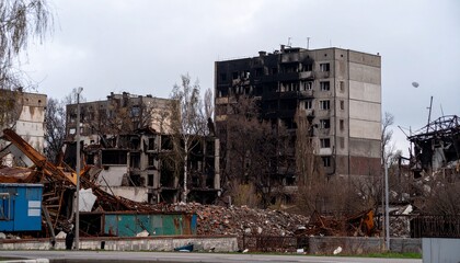 Fototapeta premium Devastated apartment buildings scarred by conflict, a stark symbol of destruction and resilience.