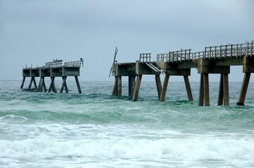 ocean beach pier damaged by hurricane.
