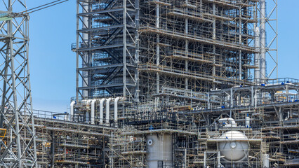 Oil and Gas refinery petrochemical plant industrial on blue sky background, Oil and Gas refinery petrochemical plant pipeline steel, Oil and Gas refinery factory maintenance, Global energy refinery.