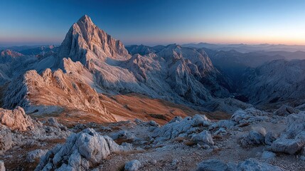 Obraz premium Mountain peak at dawn. Vast, rocky landscape
