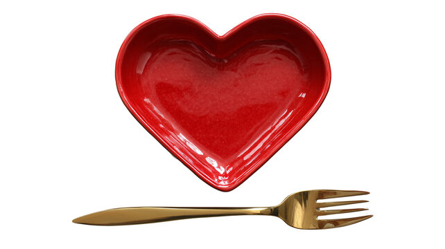 Shiny red heart shaped ceramic dish with a golden fork against a stark black background