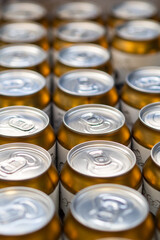 Rows of Golden Beverage Cans Ready for Refreshment