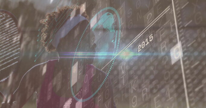 Swinging visored athlete on tennis court, with racket and holographic data overlay 2015, copy space - Powered by Adobe