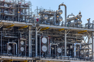 Oil and Gas refinery petrochemical plant industrial on blue sky background, Oil and Gas refinery petrochemical plant pipeline steel, Oil and Gas refinery factory maintenance, Global energy refinery.