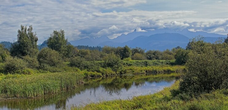 DeBoville Slough waterway running through a rural landscape, Port Coquitlam, British Columbia, Canada