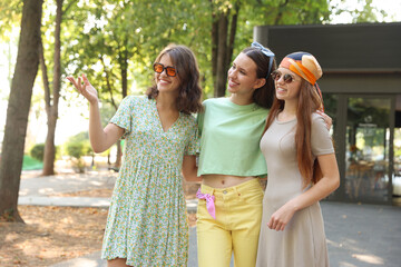 Portrait of happy friends with sunglasses outdoors