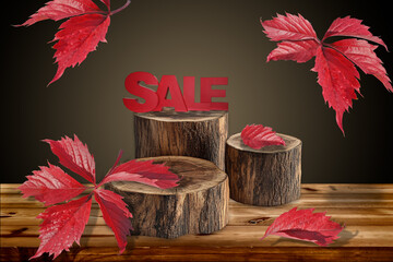 red autumn leaves of wild grapes fall on a wooden table with three round logs with the letters of...