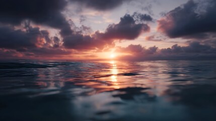 Naklejka premium Serene sunrise reflection on a calm sea