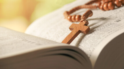 Wooden Jesus Cross on Old Book