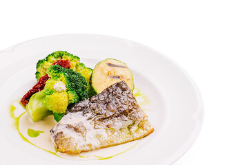 Freshly cooked fish fillet served with steamed vegetables on a plate