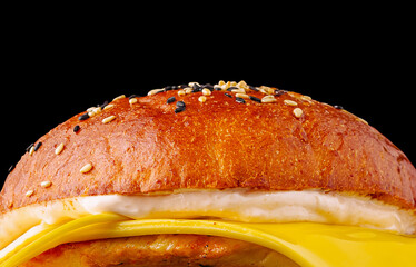 Delicious golden burger with melted cheese and sesame bun that tempts taste buds