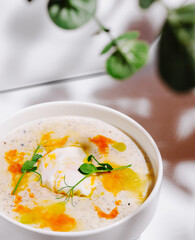 Delicious soup with vibrant toppings in a cozy setting