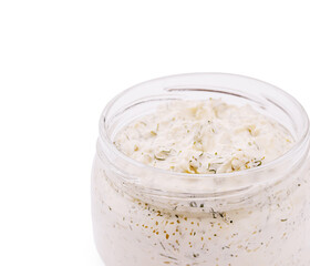 Creamy herb dip in a glass jar with fresh ingredients