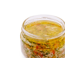 Homemade herb-infused oil in a glass jar for culinary uses