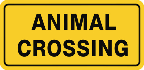 Yellow animal crossing road sign isolated on white background, warning drivers to be cautious of wildlife and animals crossing the road ahead