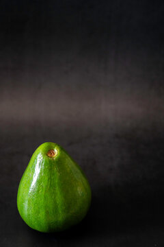 Avocado on a dark surface 