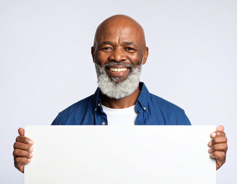man holding blank sign and smiling