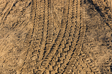 Wheel tracks on the country road. Tire track on a dusty rural road