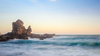 Rocky Seaside Landscape with Waves Crashing in Yogyakarta, Indonesia