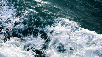 Oceanic Texture: A mesmerizing shot of the ocean's surface, capturing the intricate patterns of waves in various shades of turquoise and deep blue.