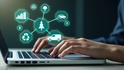 Hands type on a laptop, with glowing green eco themed icons (trees, recycling, maps) floating above, representing sustainable technology or environmental innovation.