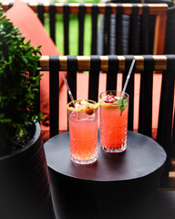 Enjoying Refreshing and Colorful Summer Cocktails on a Stylish Outdoor