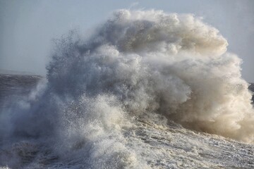Giant waves hitting the sea wall and lighthouse at Porthcawl.