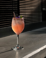 A Refreshing Cocktail Served with a Beautiful Garnish in an