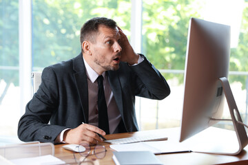 Businessman suffering from panic attack at workplace in office