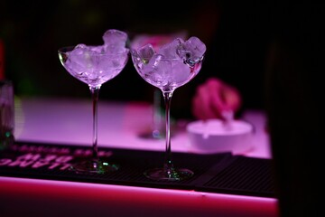 Empty Elegant Glasses With Ice Cubes	