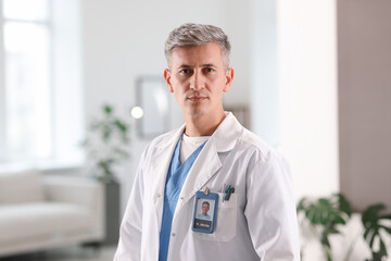 Portrait of doctor in white coat indoors