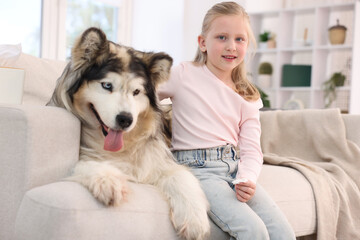 Girl suffering from allergy with her dog at home